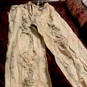 Distressed denim jeans
